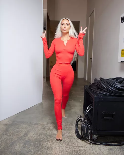 Red Outfit Showing Off Her Curves