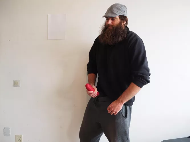 Me, while a large red dildo sticks out of my pants