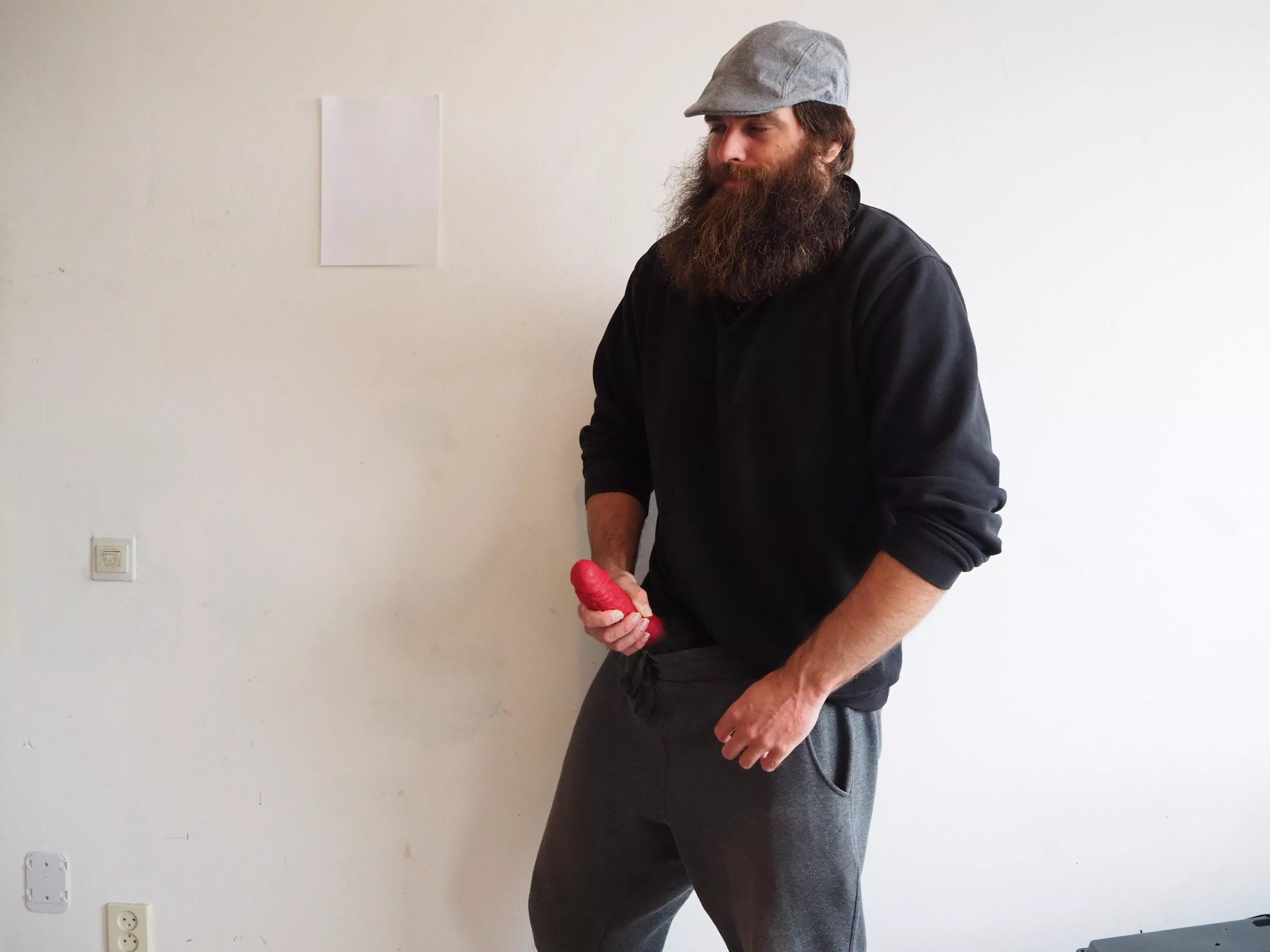 Me, while a large red dildo sticks out of my pants