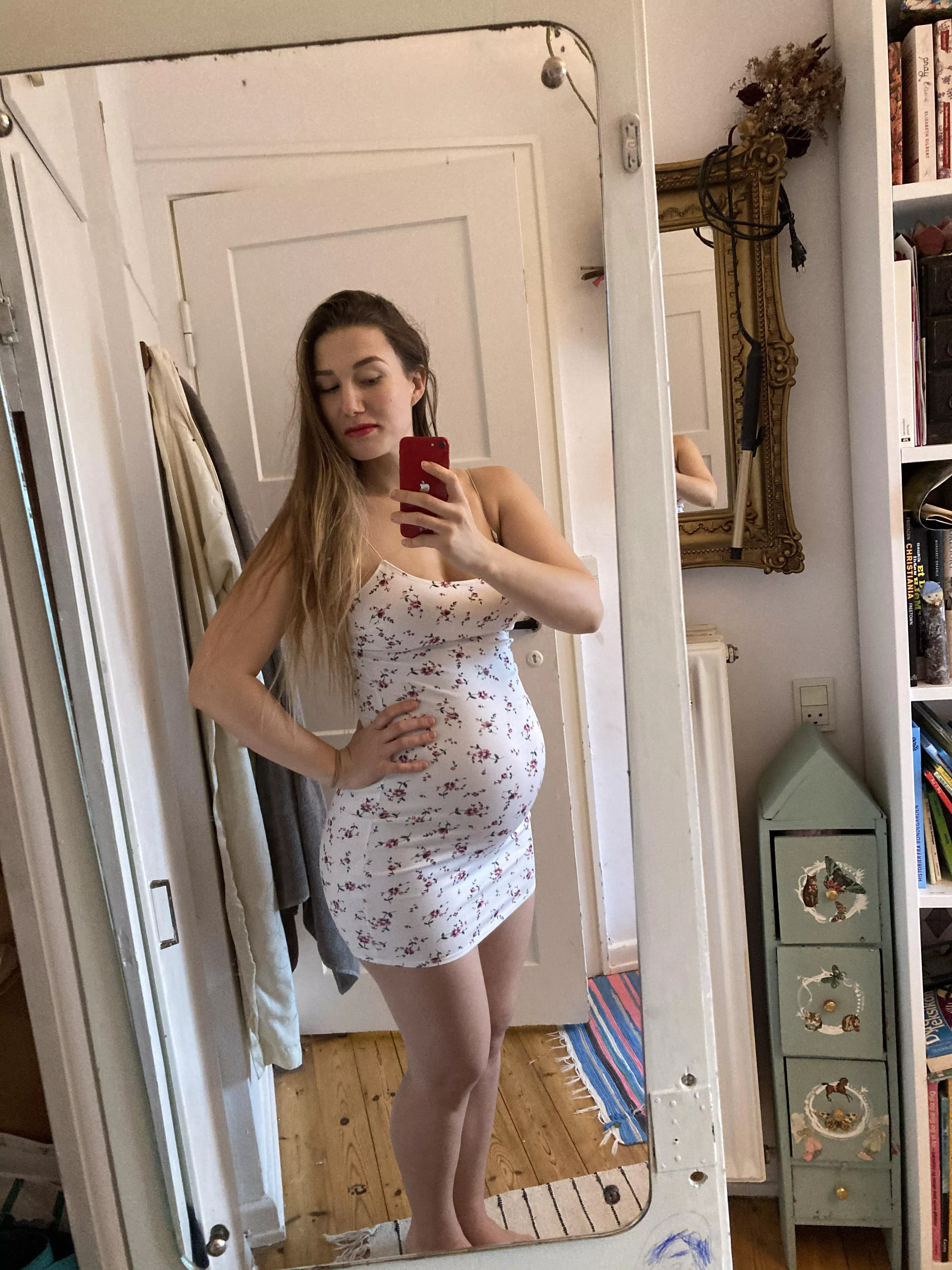 This tight dress shows off my pregnant belly so much