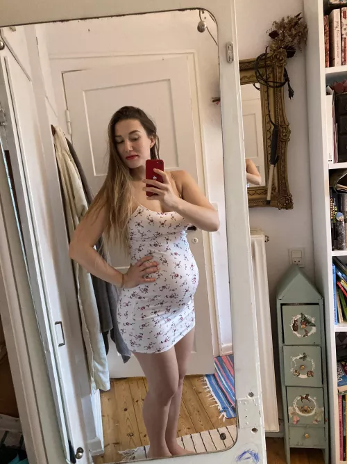 This tight dress shows off my pregnant belly so much