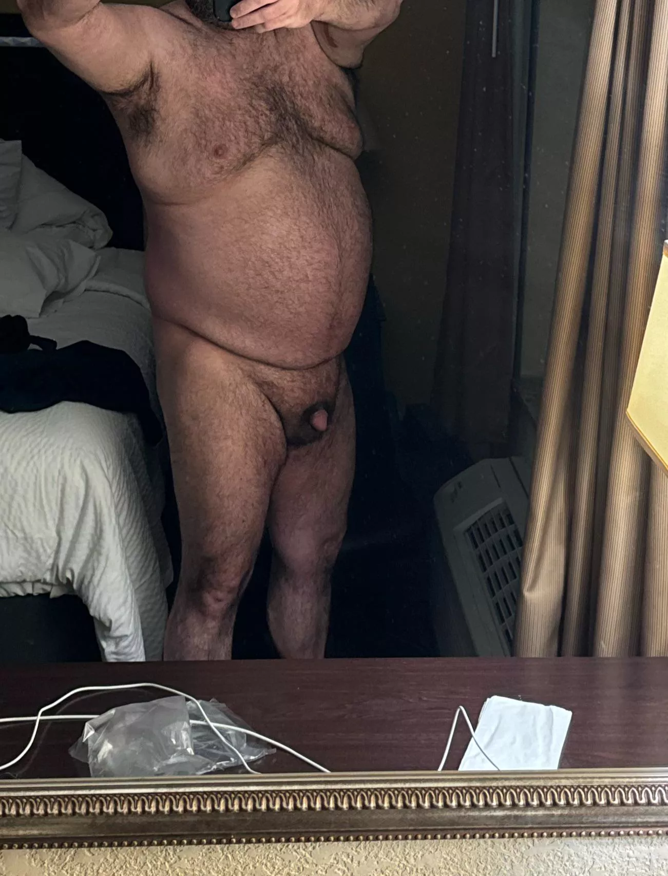 Standing in front of the hotel window 