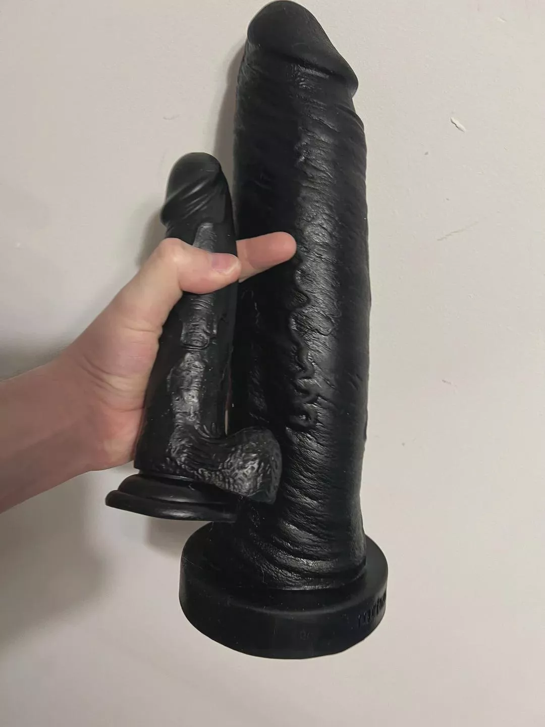 My first dildo from 2019 next to my current max toy. I guess you could say I’ve made progress.