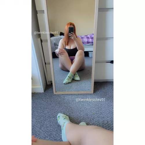 Green socks for this redhead