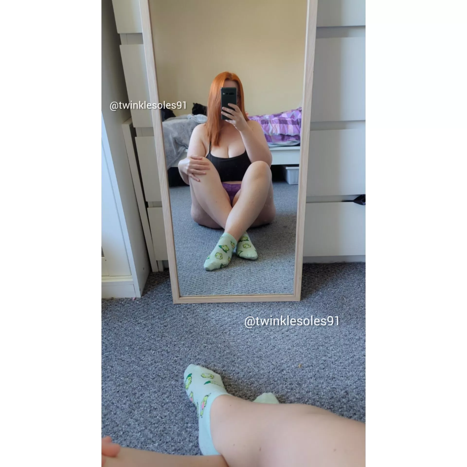 Green socks for this redhead