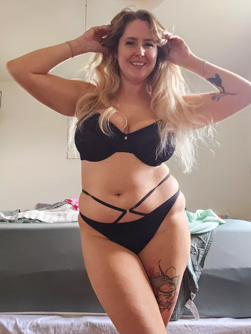 wearing something black and strappy 