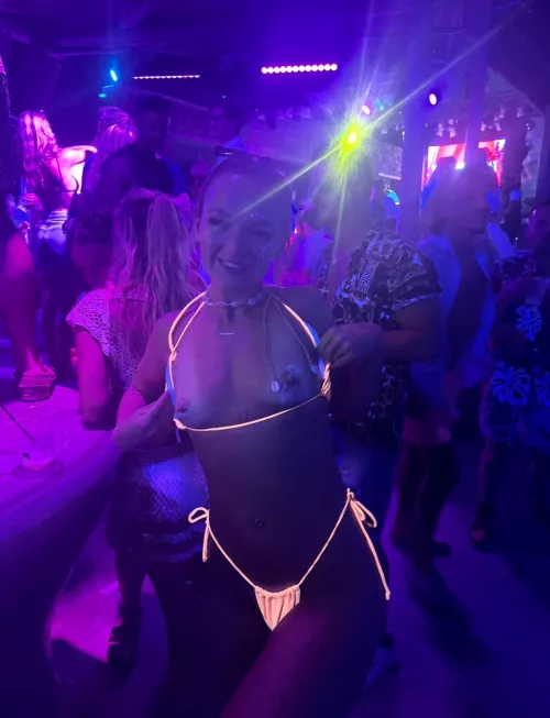 tits out for mykonos beach club 