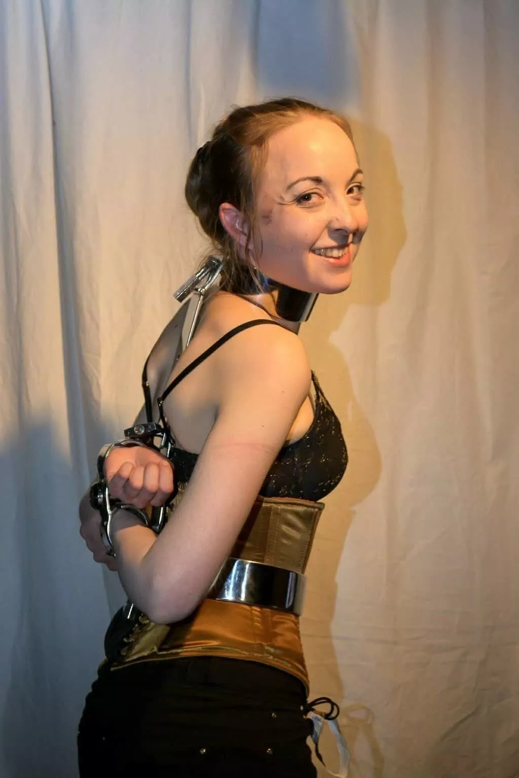 Metal bondage and a smile