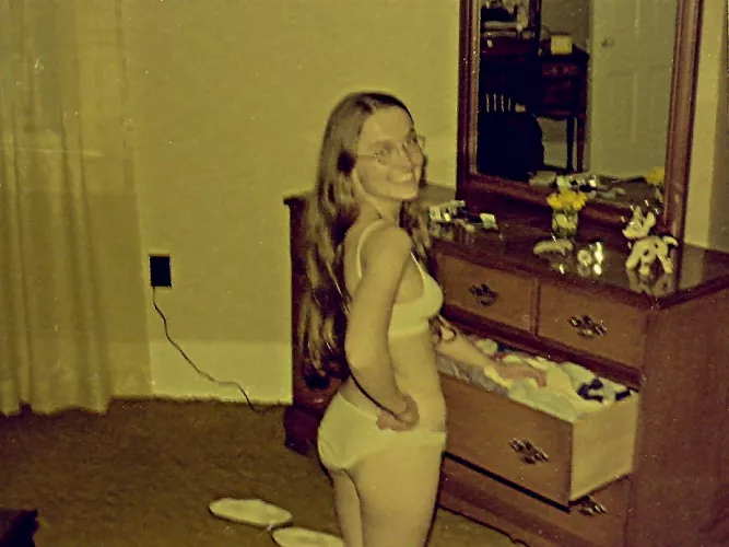 Putting laundry away on our hippie commune - early 1970s. I'm on my knees - I'm not that short!