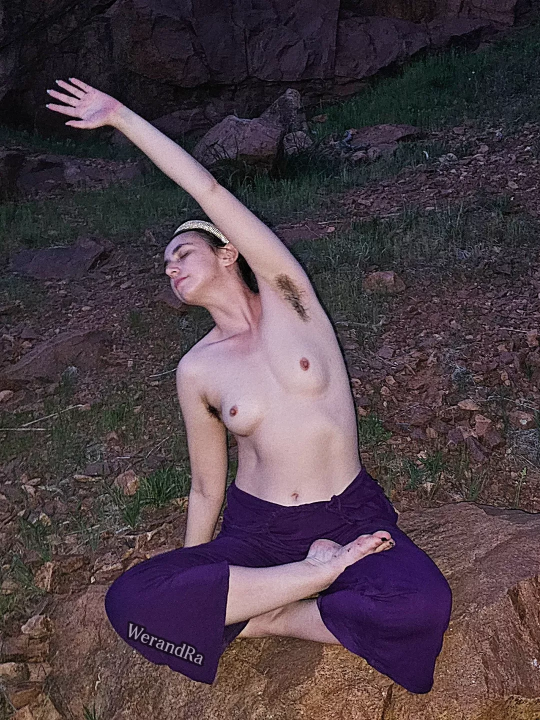 Topless stretching at night in nature