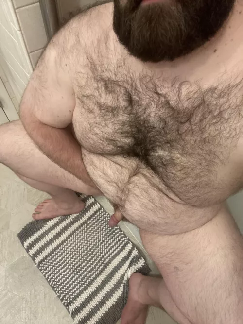 Sitting on the side of the tub, waiting for you