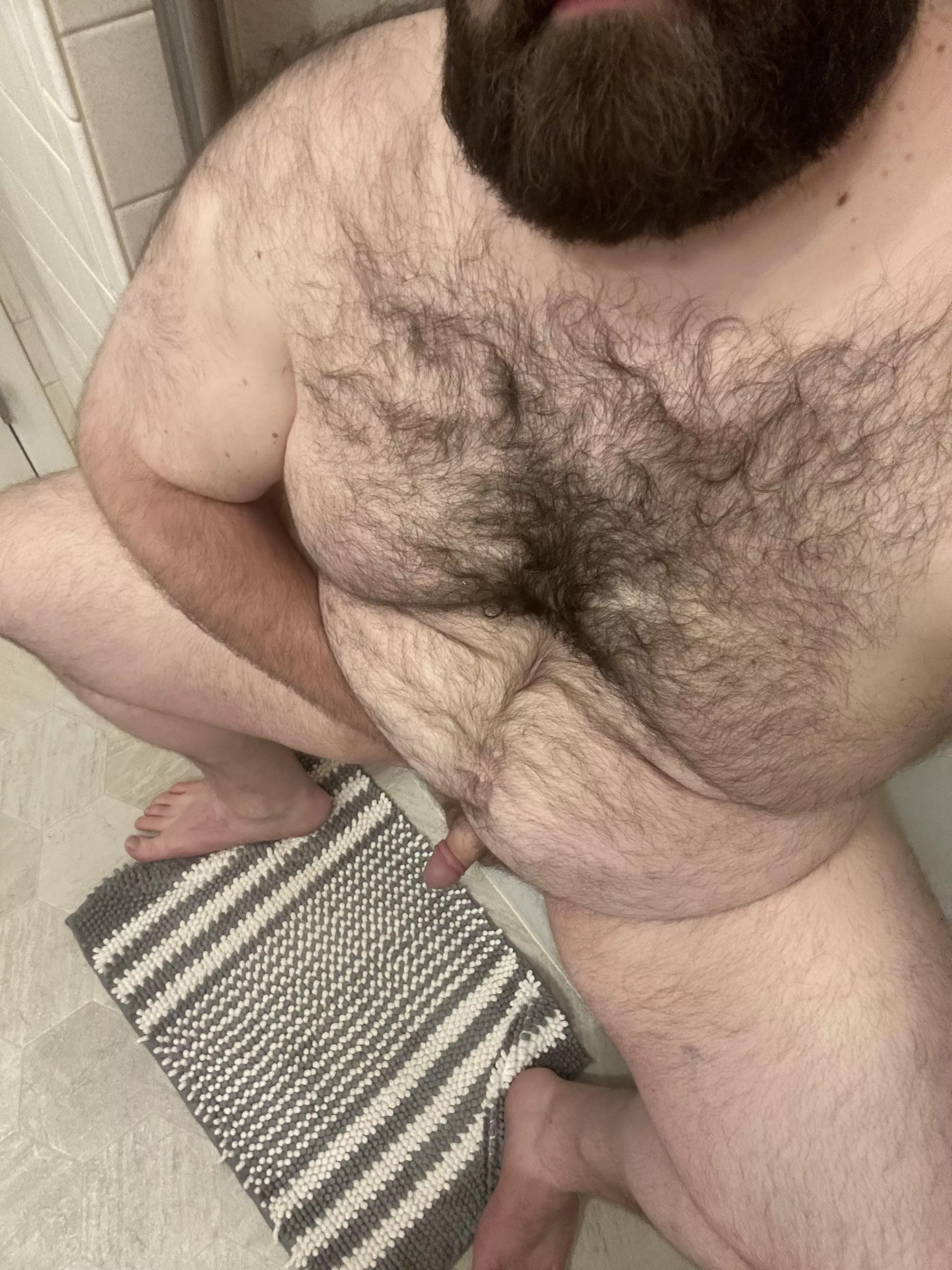 Sitting on the side of the tub, waiting for you