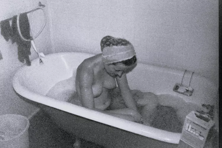 Yes, my turn for a bath! During cold weather, Saturday night was warm bath night on our hippie commune - this old tub kept the water warm. Early 1970s.