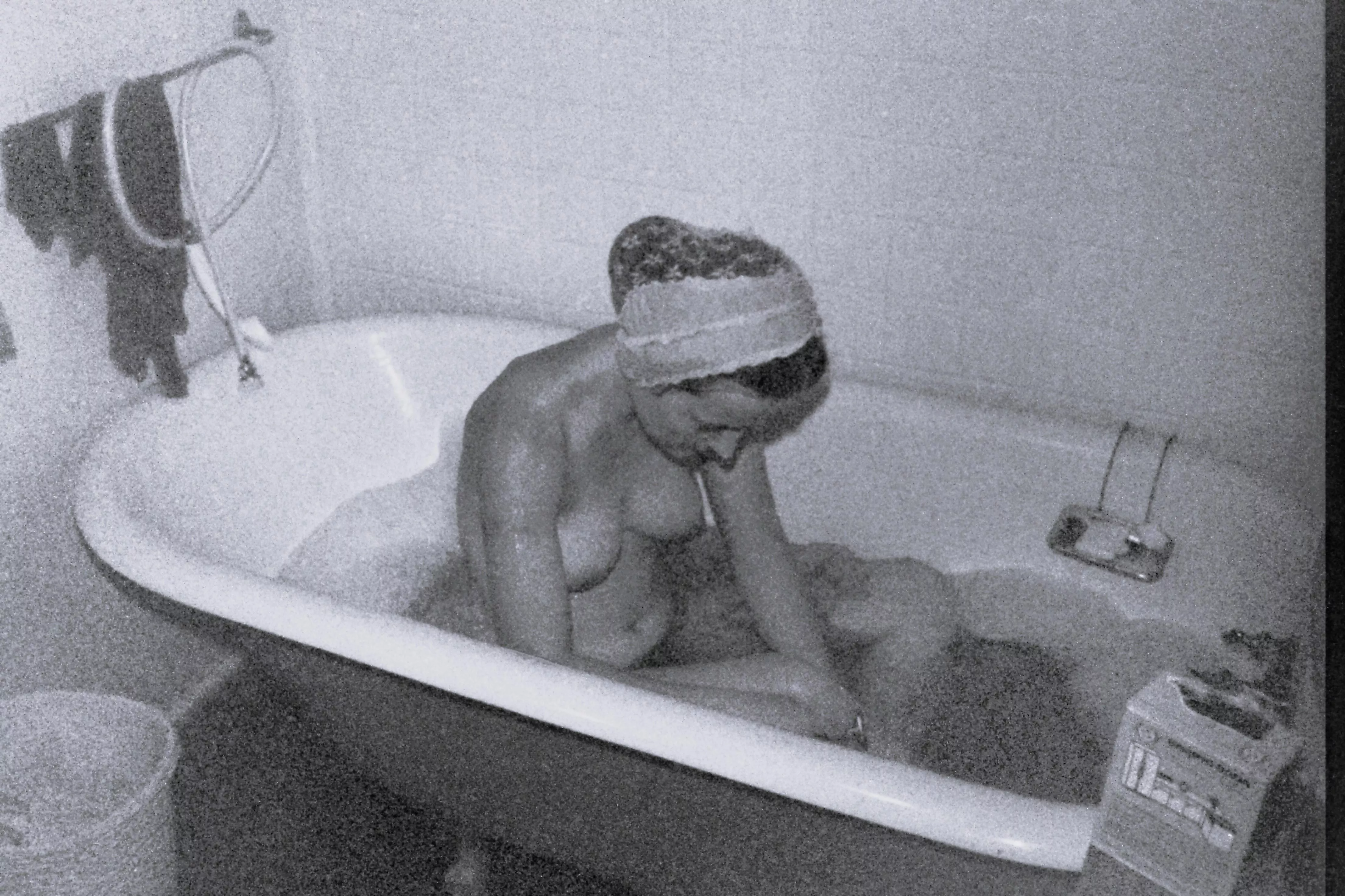 Yes, my turn for a bath! During cold weather, Saturday night was warm bath night on our hippie commune - this old tub kept the water warm. Early 1970s.