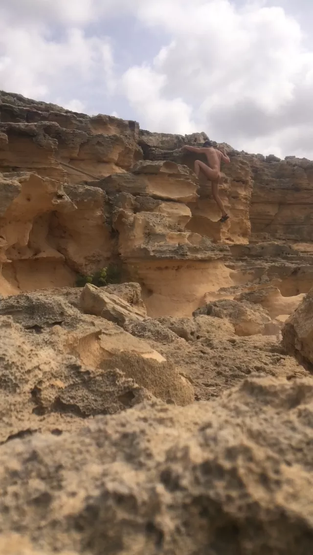 Climbing at nudist beach, mallorca near puig de ros