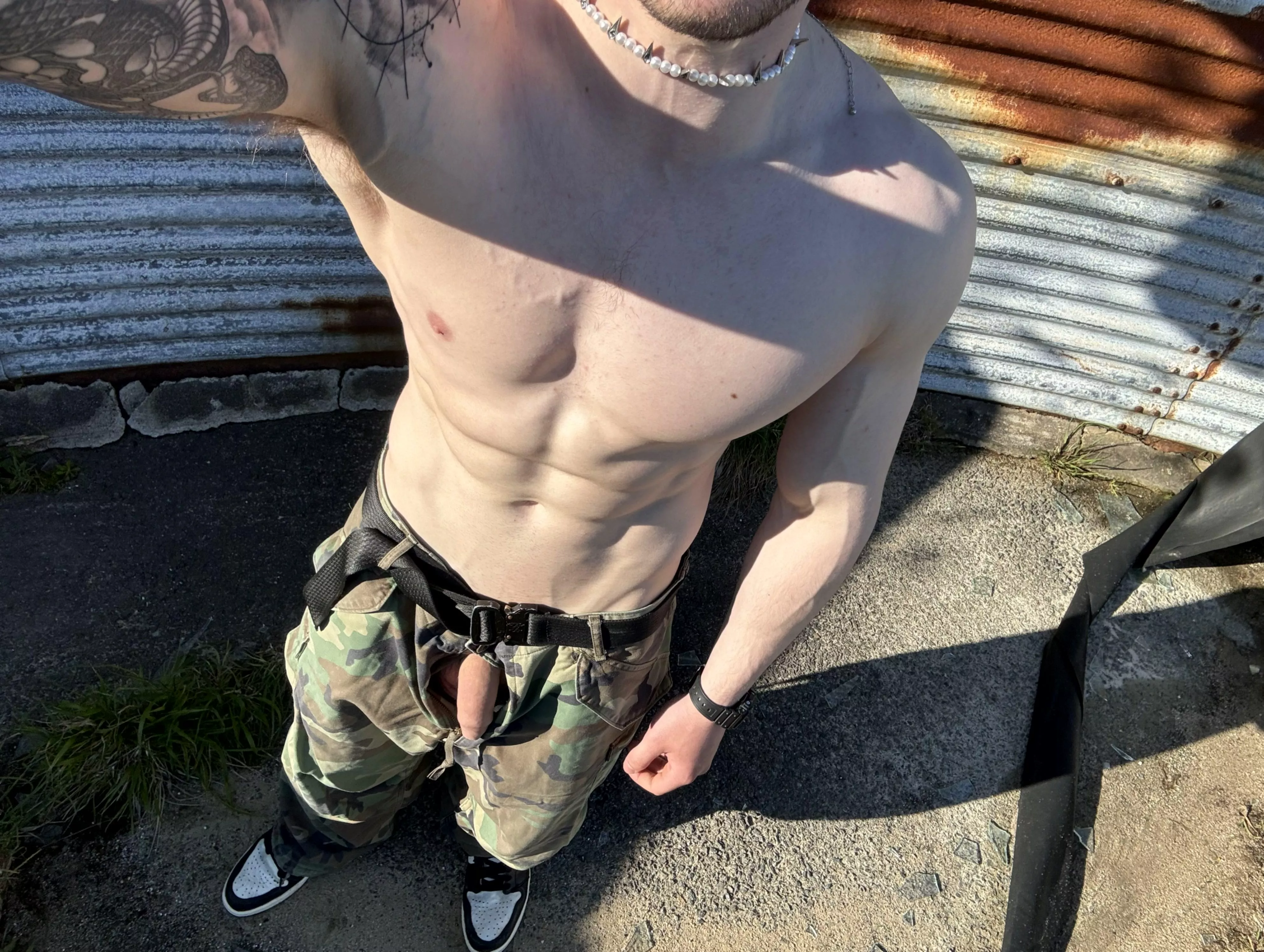 What tattoo should I get on my right pec? ps- cock poking out through trousers ;)