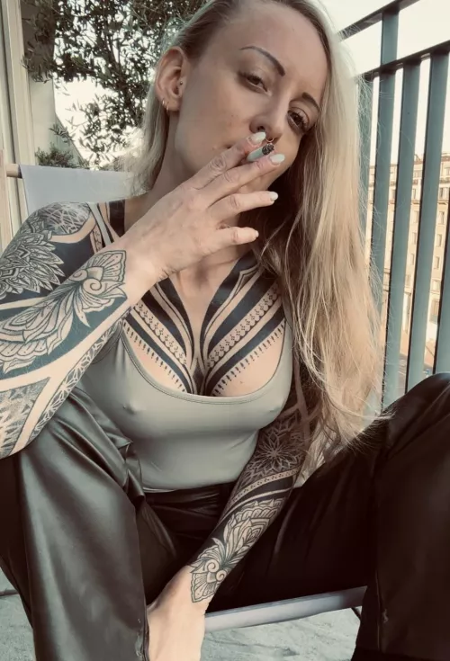 First I take a drag on the cigarette and then on you