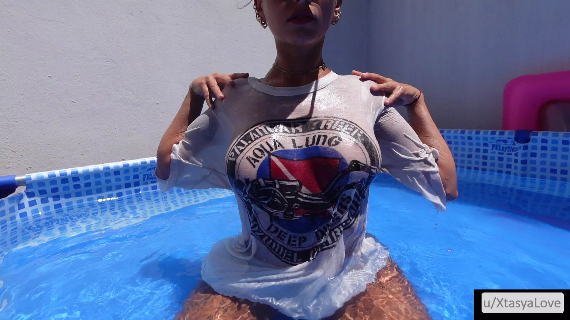 Wet and pressed against perfect tits