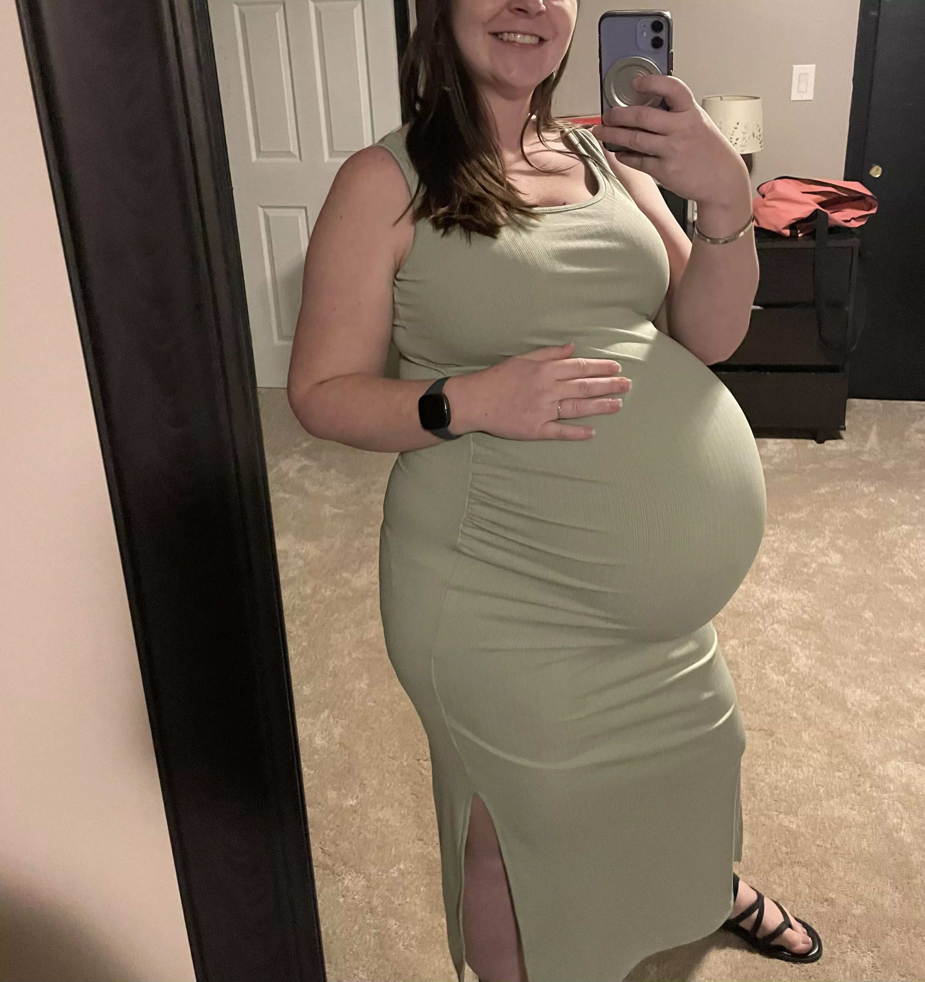 Do you like how tight my dress is on my pregnant belly?🥵