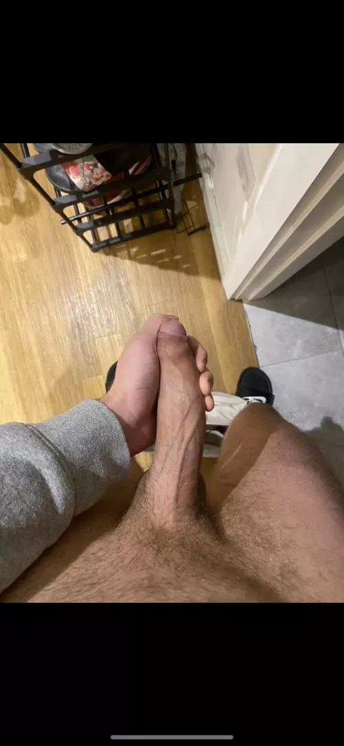 Holding my heavy cock like a shotgun. Let me show you how much power it holds