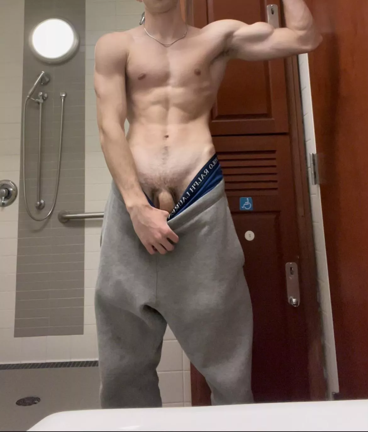 flexing in the gym locker room showers m18