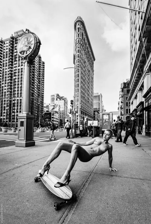 Marisa Papen naked on a skateboard on the streets of New York, by Gary Breckheimer