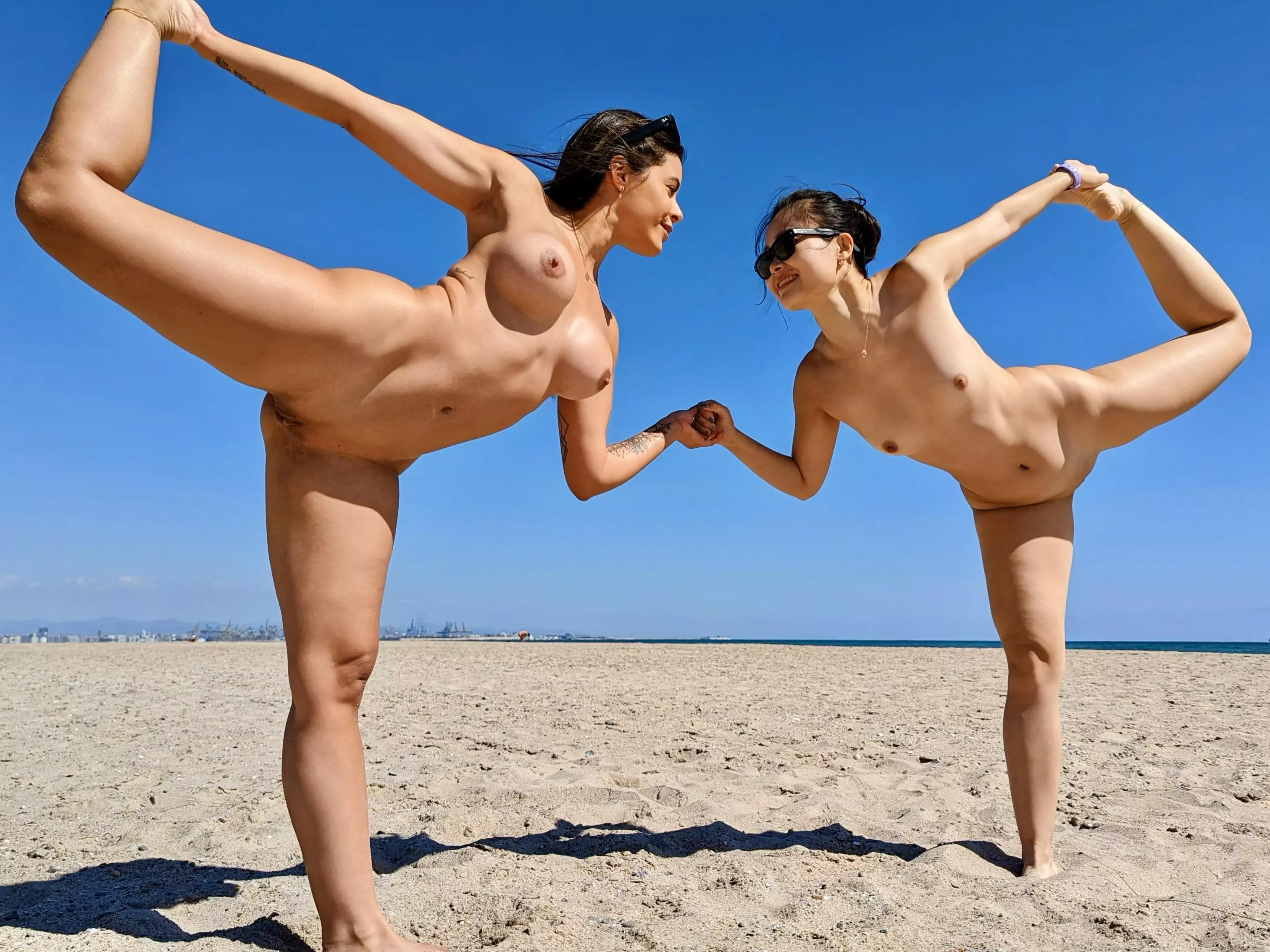 No better way to do yoga than naked and in public with a friend