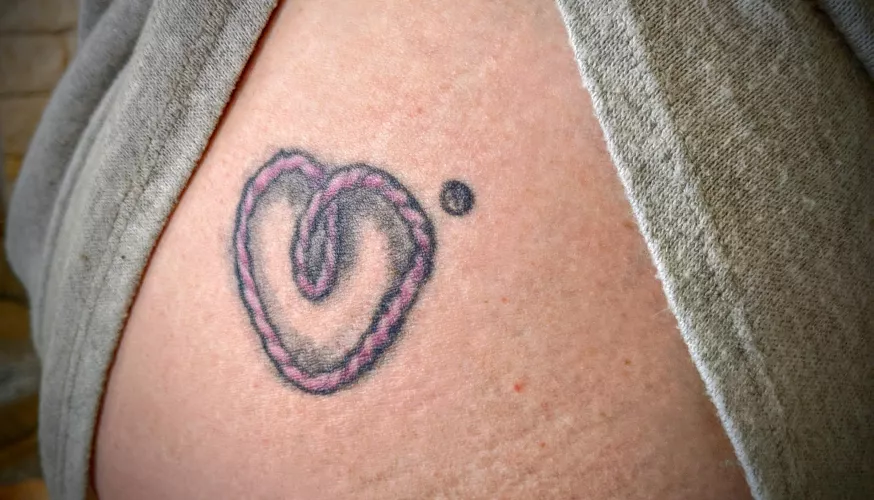 Dee Luvbight can be identified by the tattoo on her right ass cheek.  We actually had our logo registered with the USPTO.