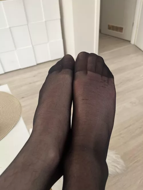 Feet in black nylons 