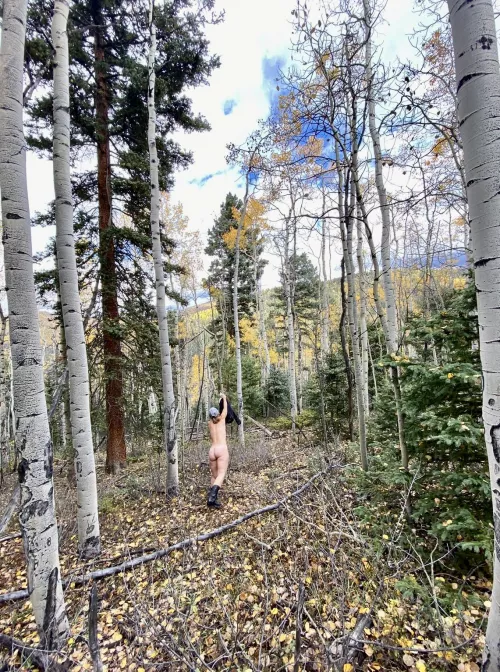 When posing nude outdoors, “nature’s coat rack” comes in handy.