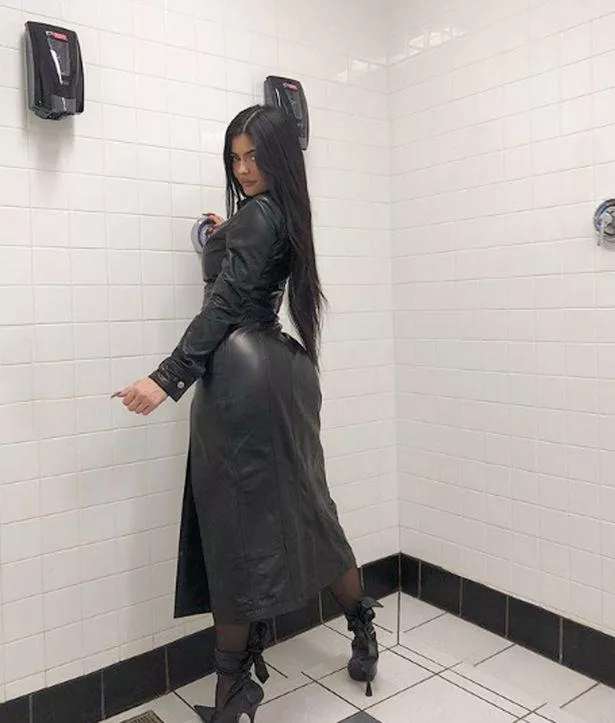 Long leather jacket and high heels