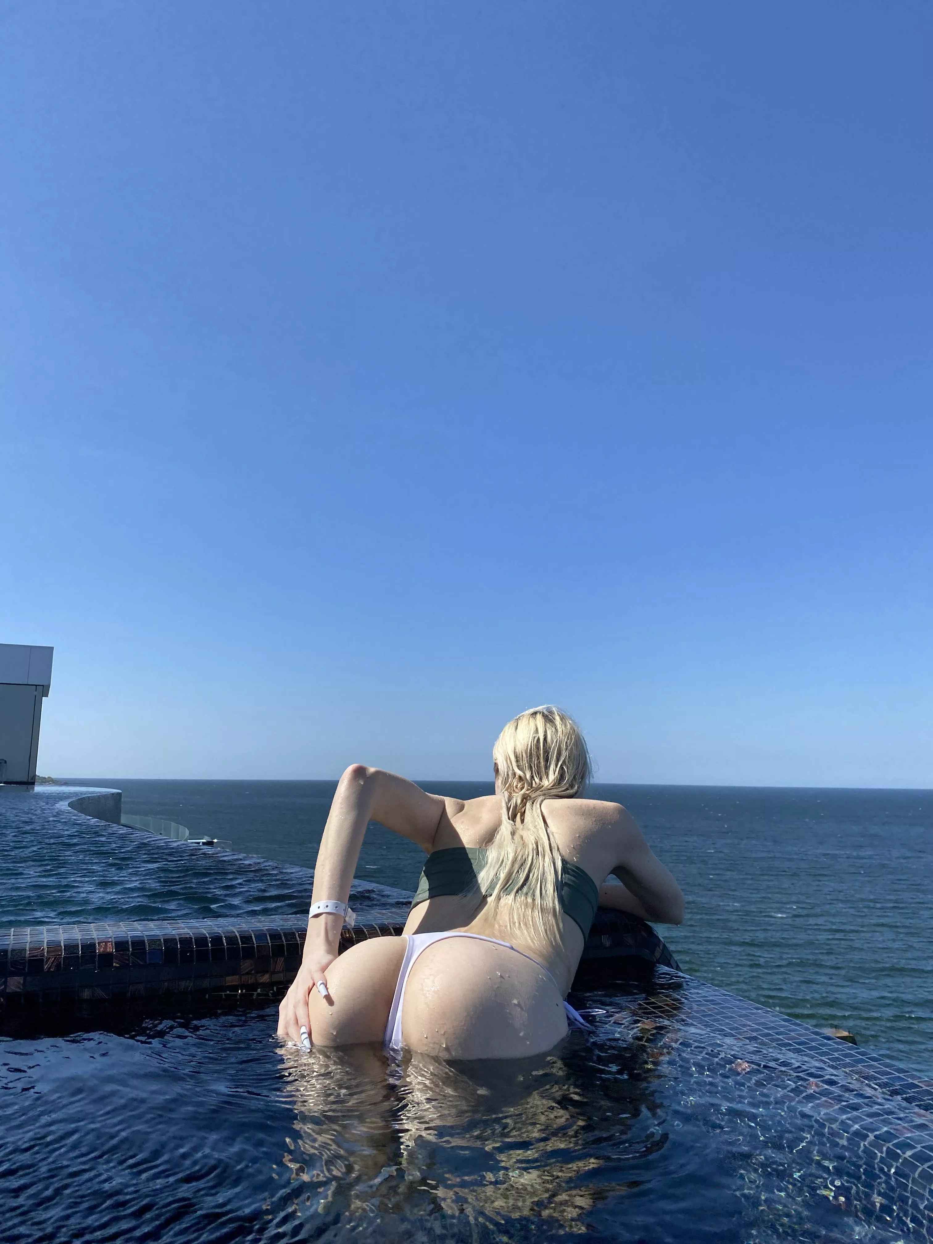 Swimsuit booty in outdoor pool