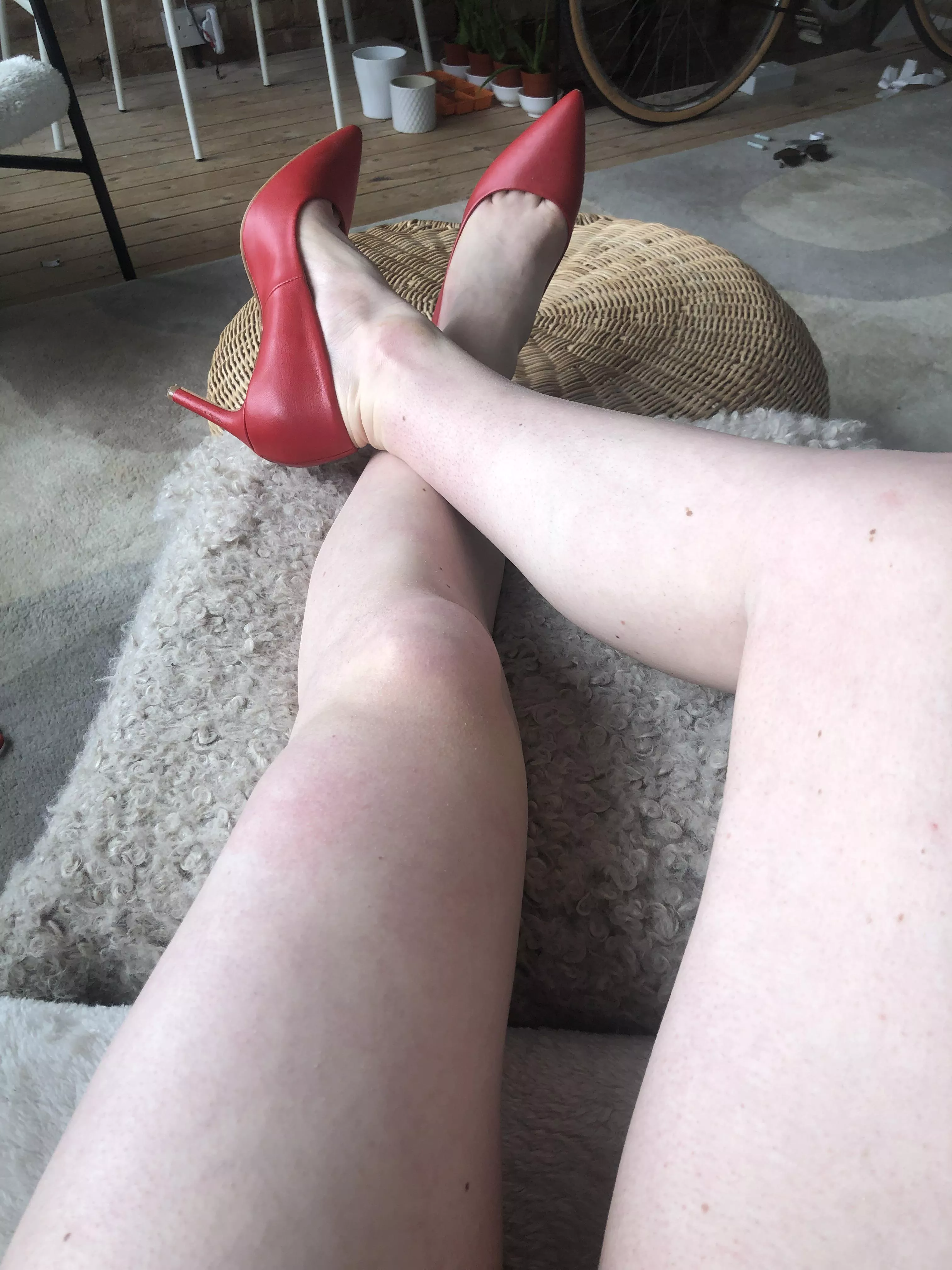 Red faux leather heels long view