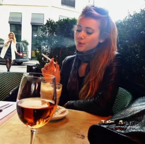 You and your girlfriend stop for drinks while sightseeing, and naturally she needs a cigarette 