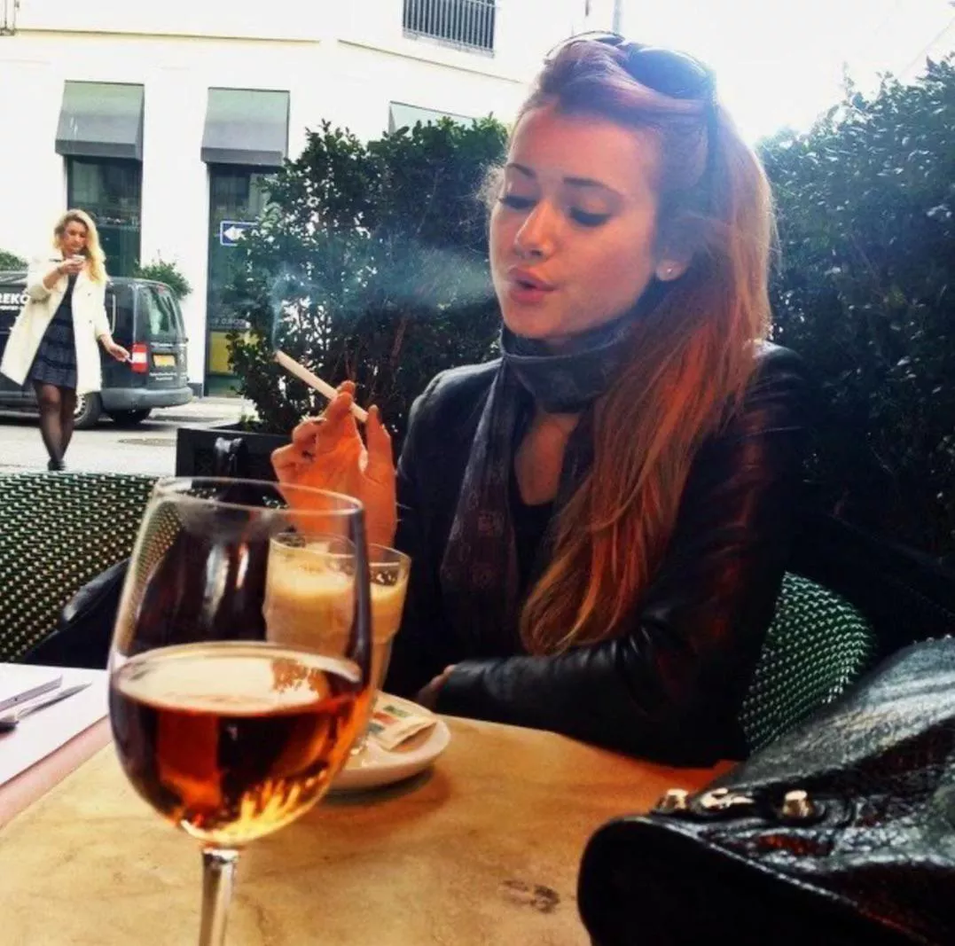 You and your girlfriend stop for drinks while sightseeing, and naturally she needs a cigarette 