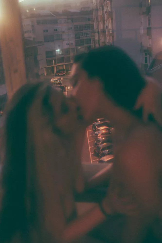 Kisses at the window in the sunset 