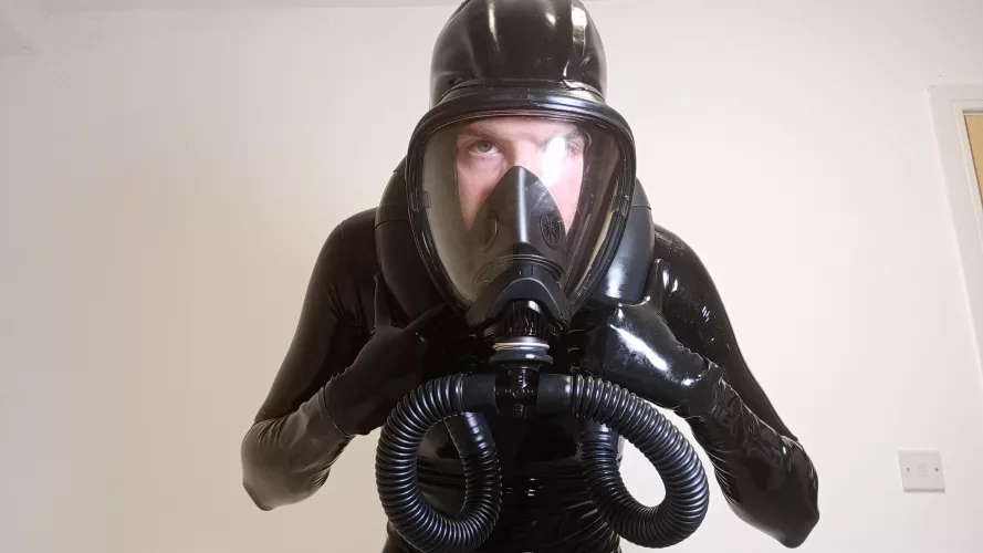 Hooded gas mask makes full enclosure easier