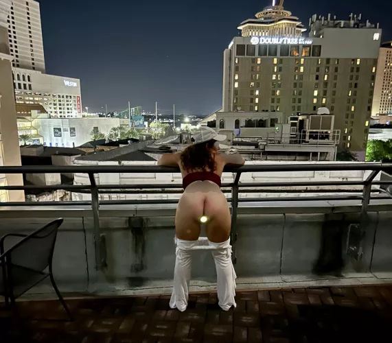 Annie (wife, 55) showing off the light from her LED buttplug on the roof in NOLA. It was a fun night!