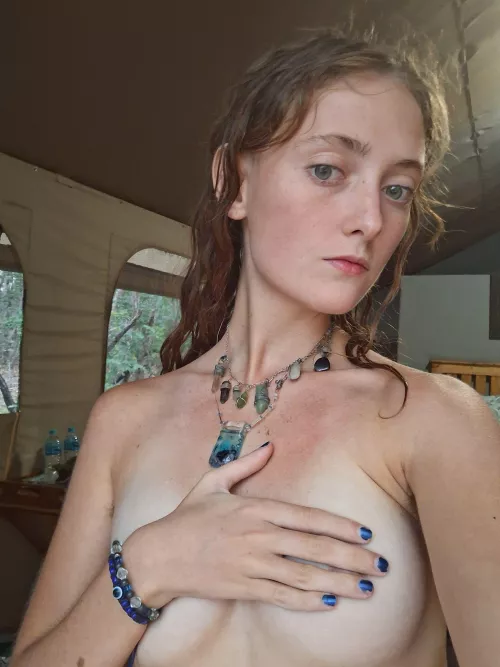 Playful tease with a handbra, feeling cheeky