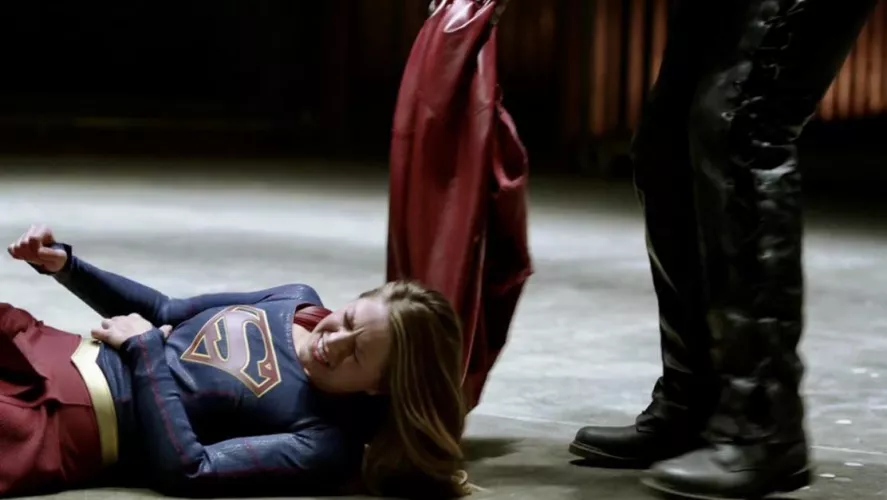Poor Supergirl. Dragged by her cape