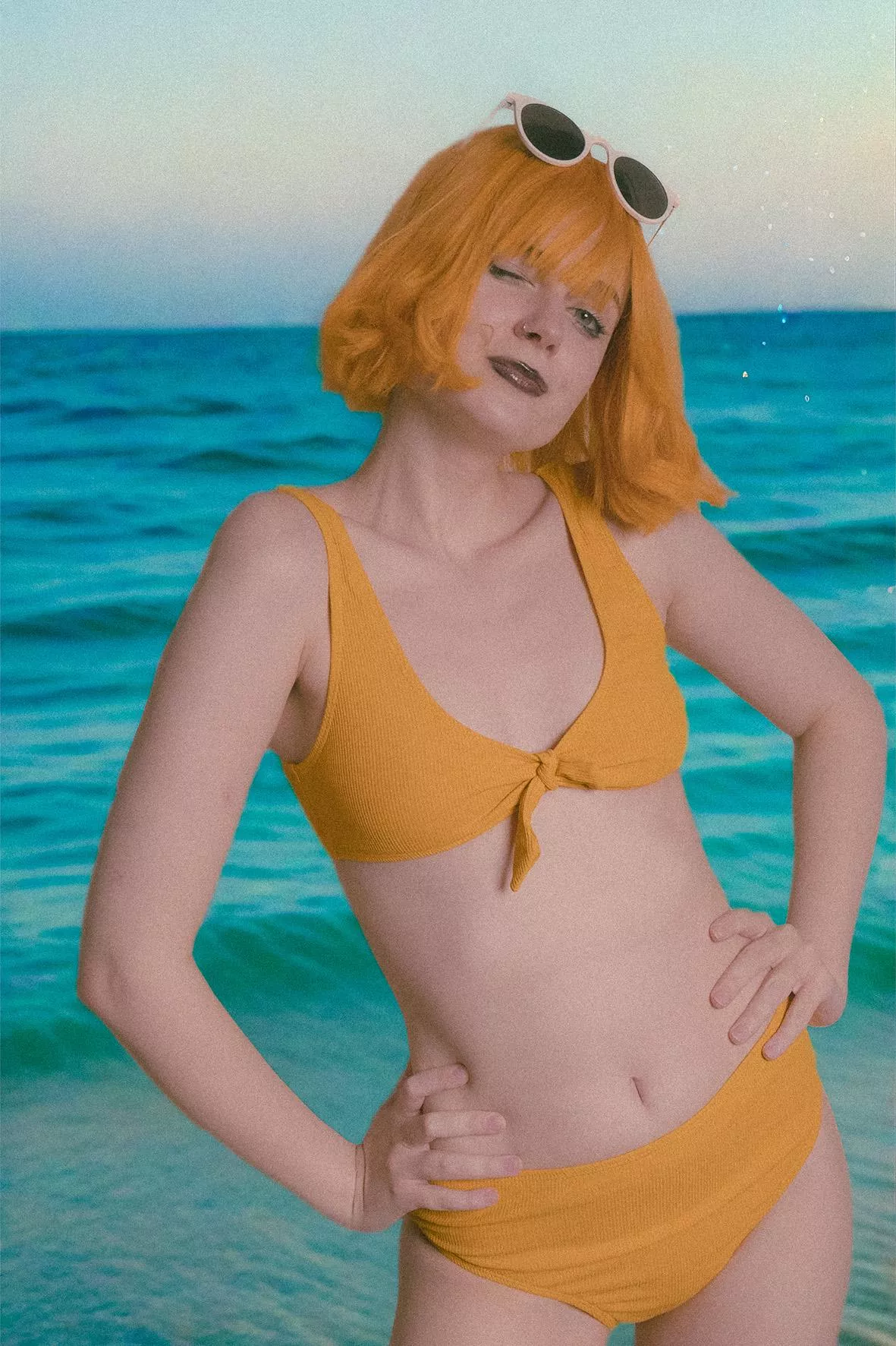 Yellow bikini is perfect to meet the sunset