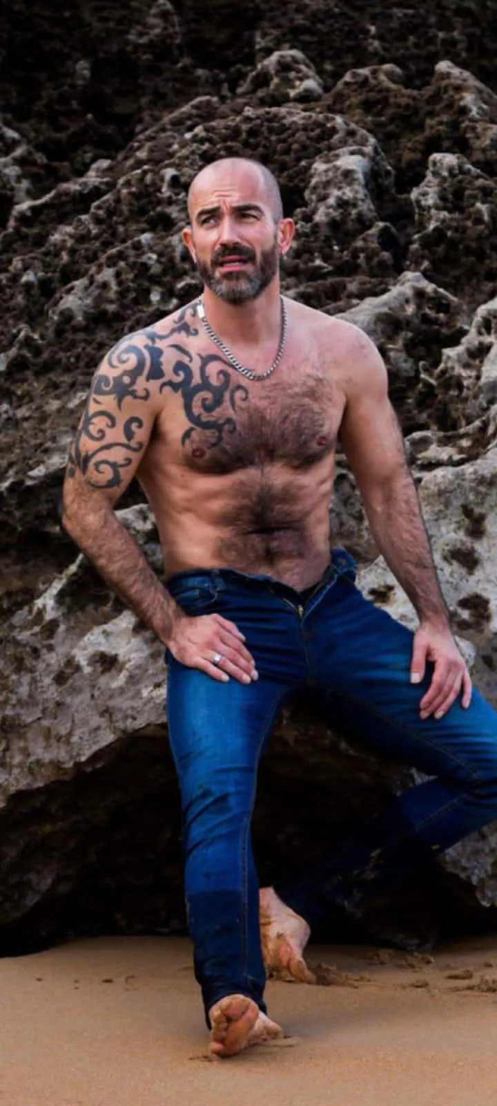 Bare it all: Sun, surf, and tattoos - the ultimate beach combo.