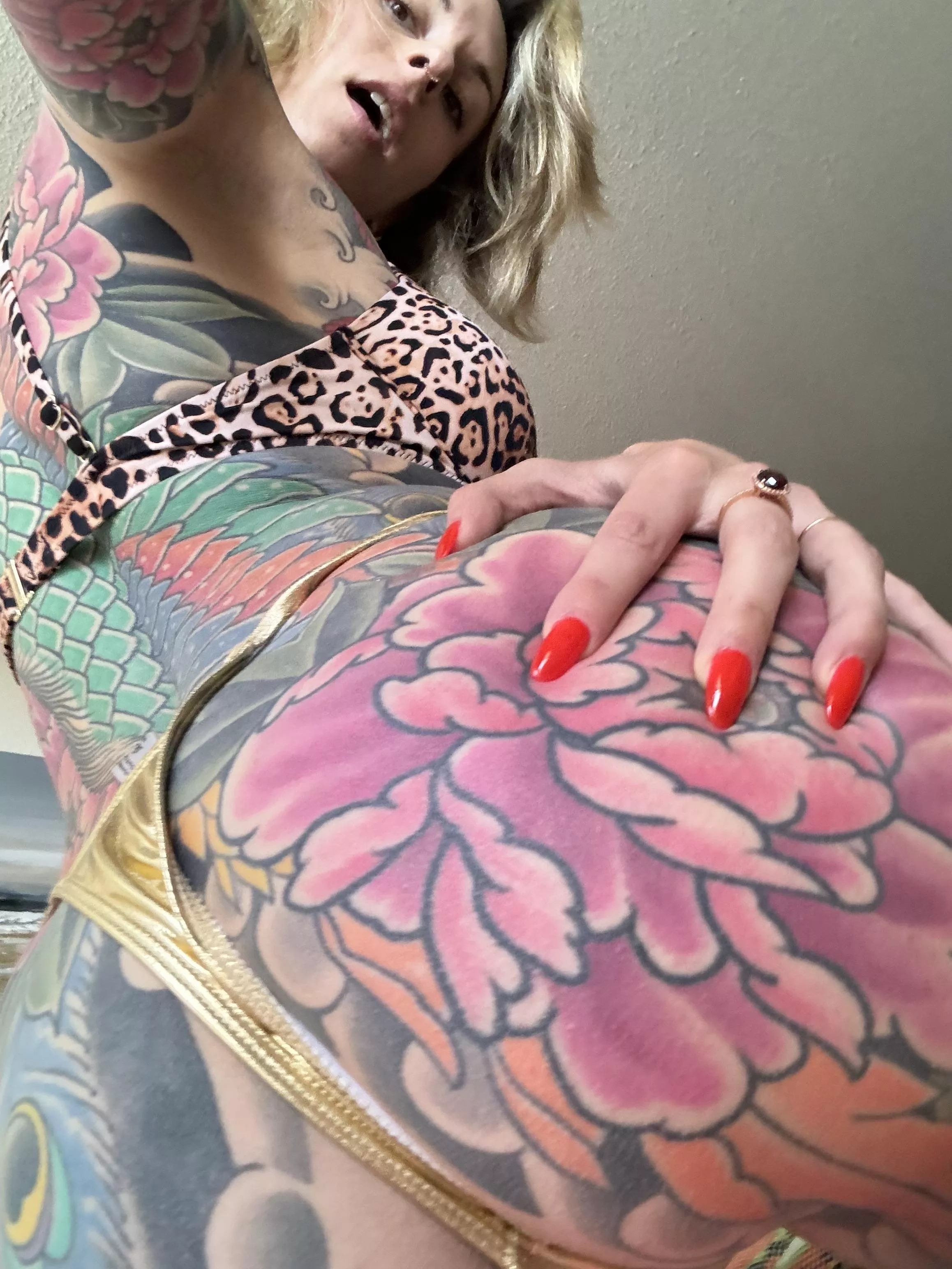 Red nails and tattoos 