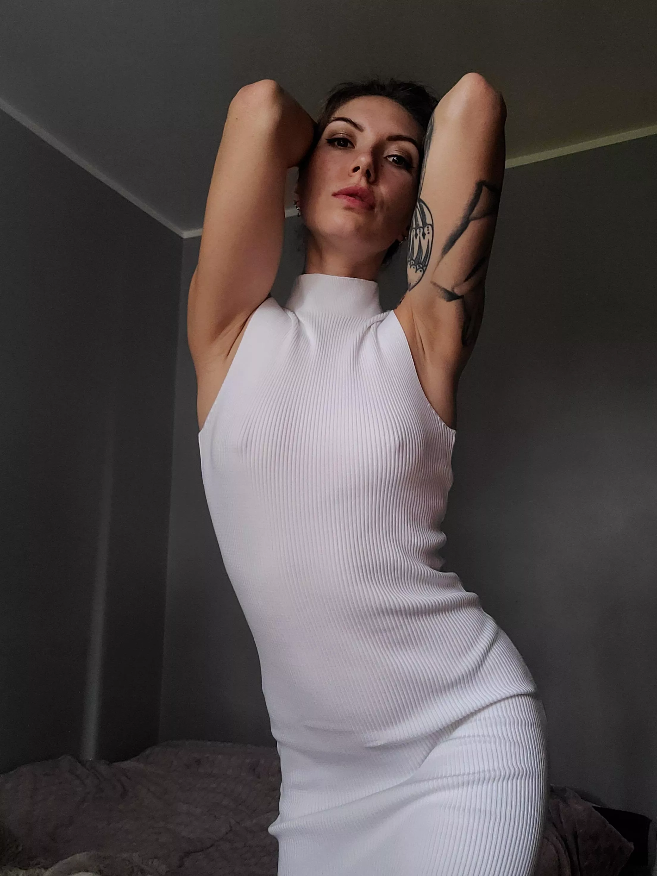 Braless in a white dress