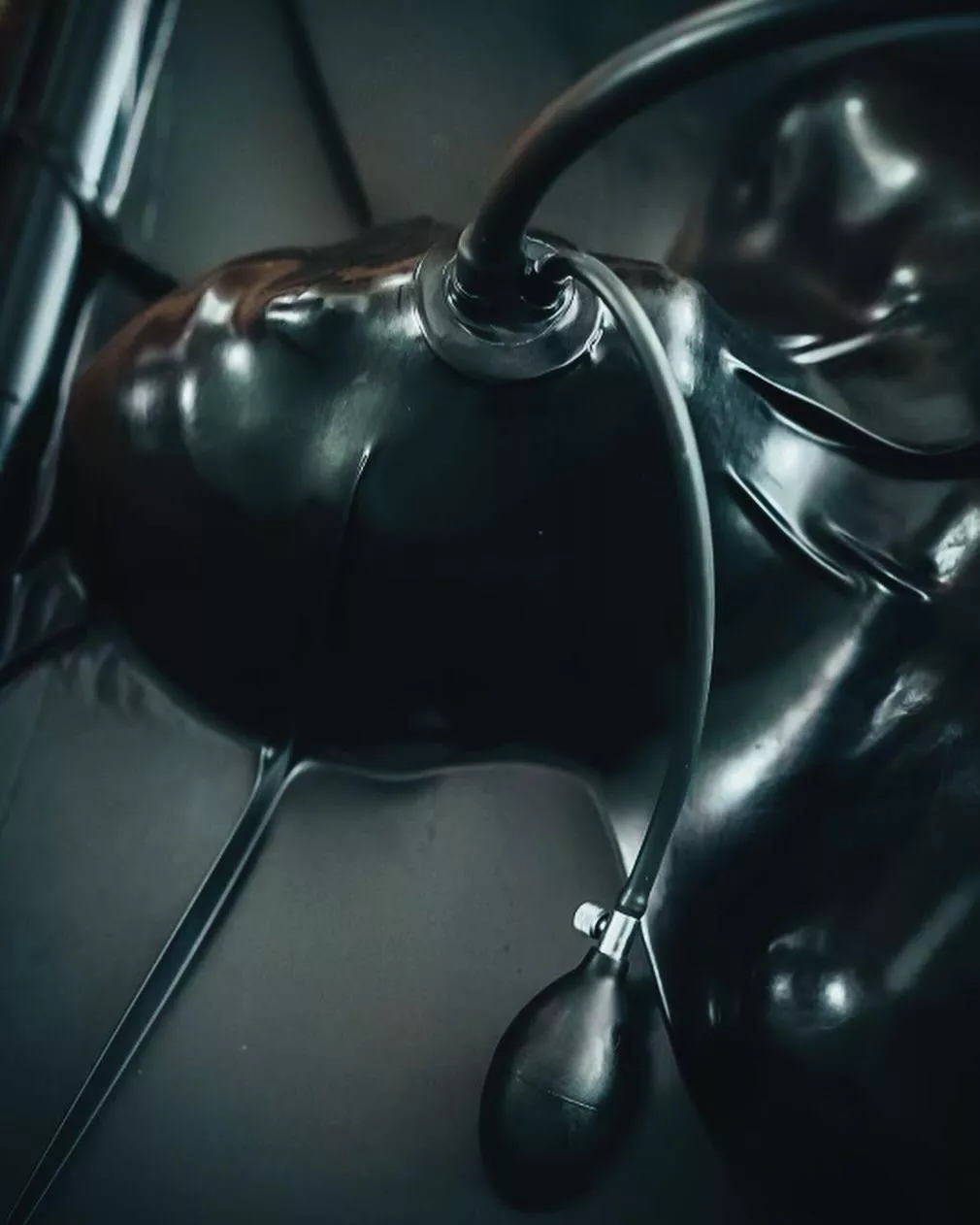 Fully encased in latex with an inflatable gag. Absolute restriction with a simple squeeze.