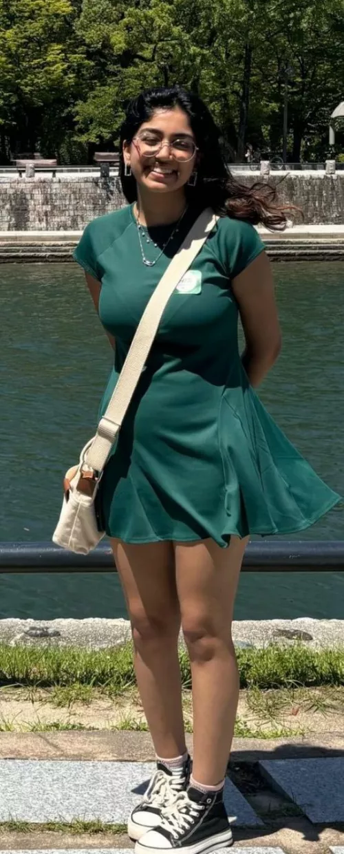 Her bag is doing a great job of showing off her bra lines and huge tits