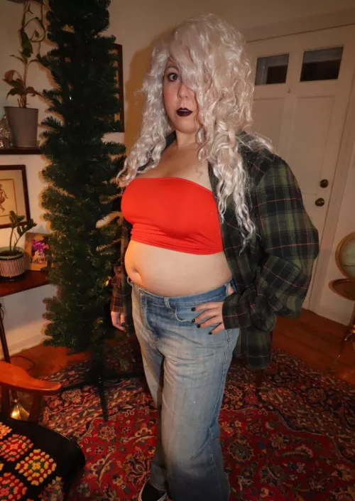 Showing off that belly in a tube top