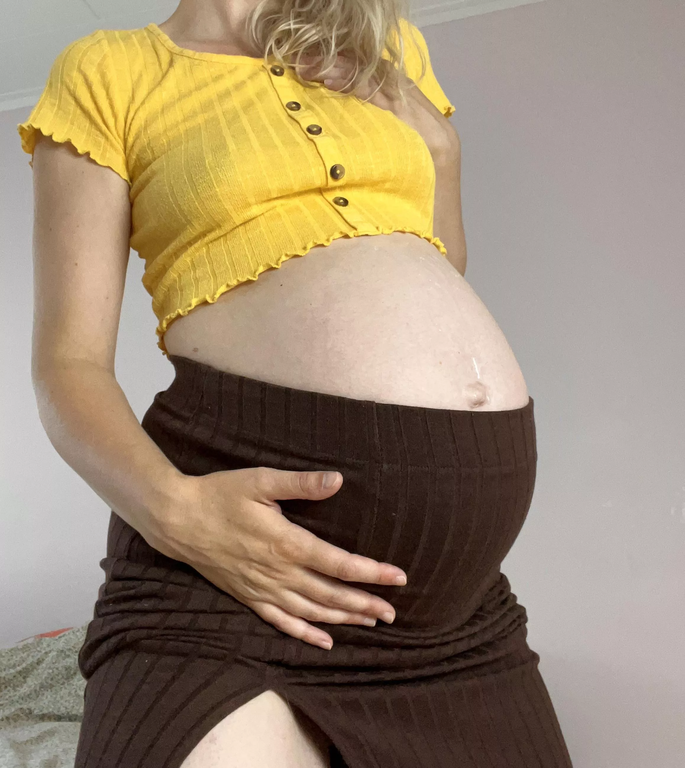 My pregnant belly loves to peek out my clothes 