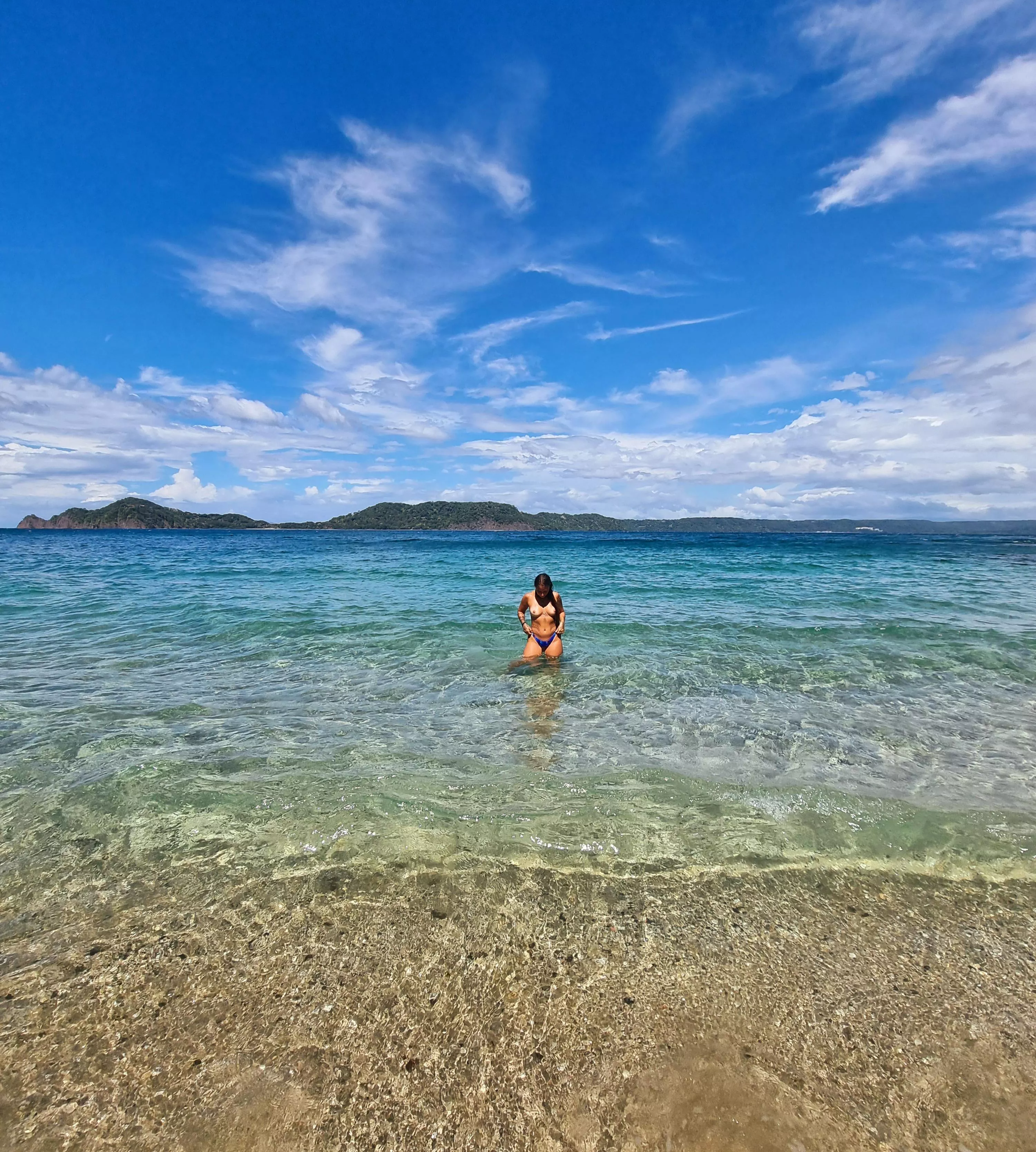 Taking off my swimsuit on a public beach.