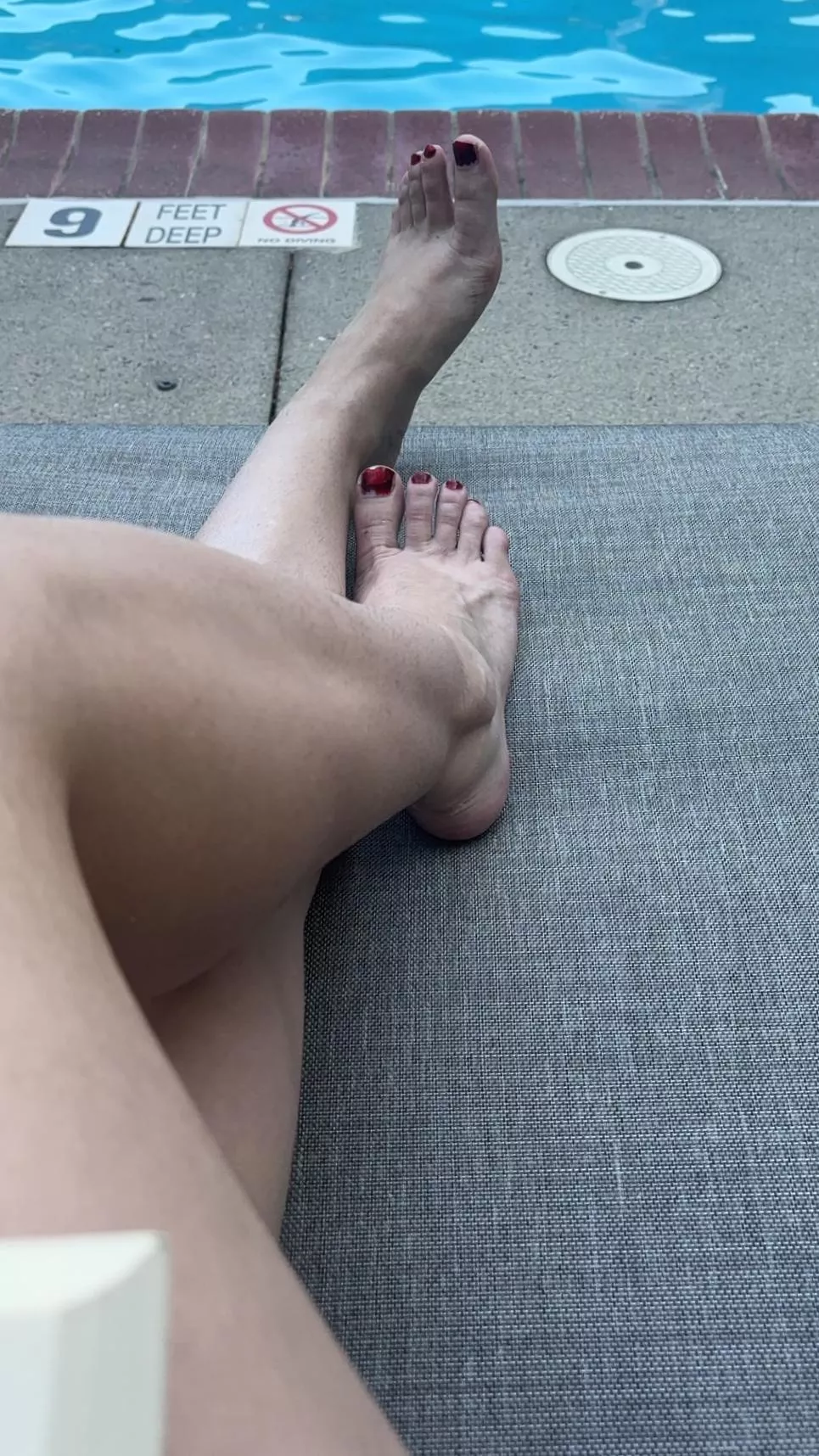 Feet by the pool